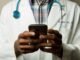 Doctor using an app on a smartphone device as healthcare regulator MHRA is fast-tracking new AI tools that promise to dramatically improve patient care.