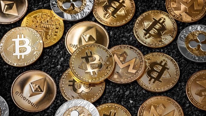 Picture of different crypto coins laying on top each other