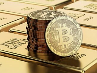 Picture of bitcoins sitting on top of a stack of gold bricks