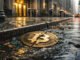 Cracked Bitcoin coin in a rain-soaked curbside gutter outside a financial district building as Wall Street continues on unfazed